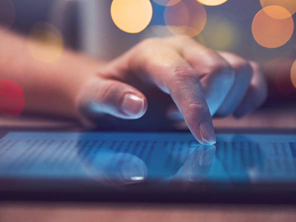 person scrolling on a tablet